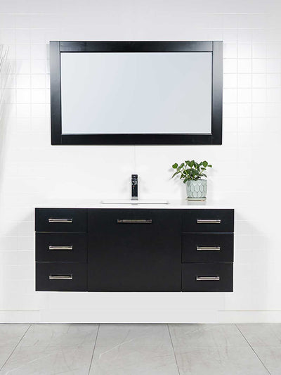 Black floating vanity with drawers, black framed mirror, white counter