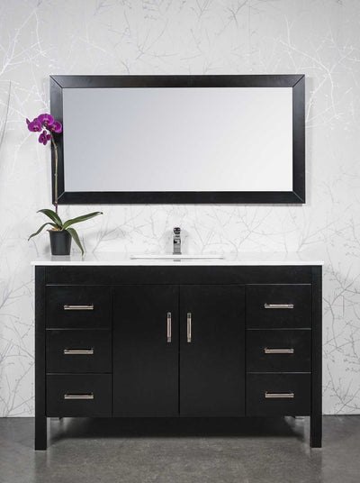 55 inch black vanity with drawers on either side and cupbaord in the center. white counter. black wood framed mirrors