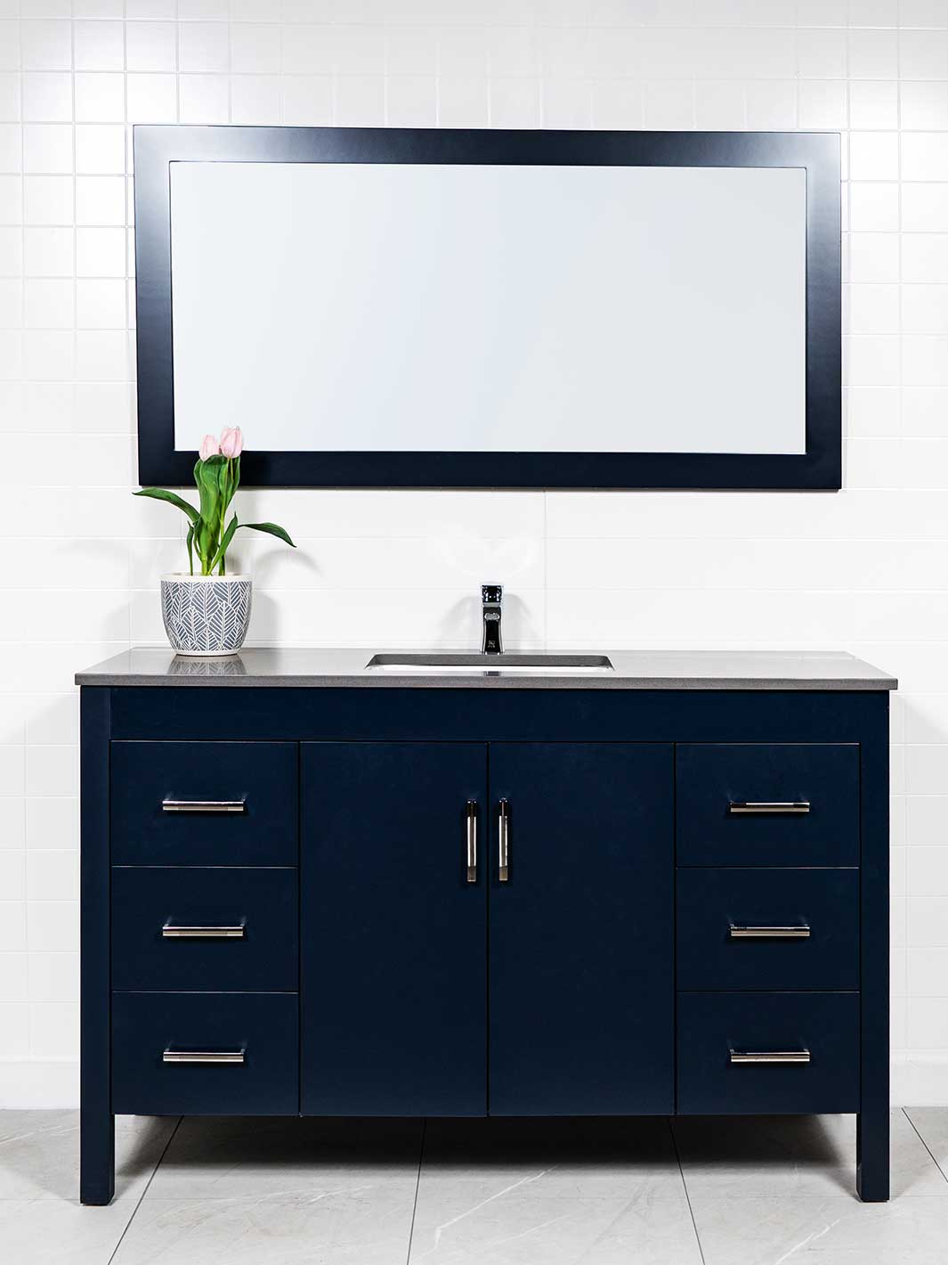 55 inch navy blue vanity with matching mirror. the vanity has 3 drawers on either side and a cupboard in the center