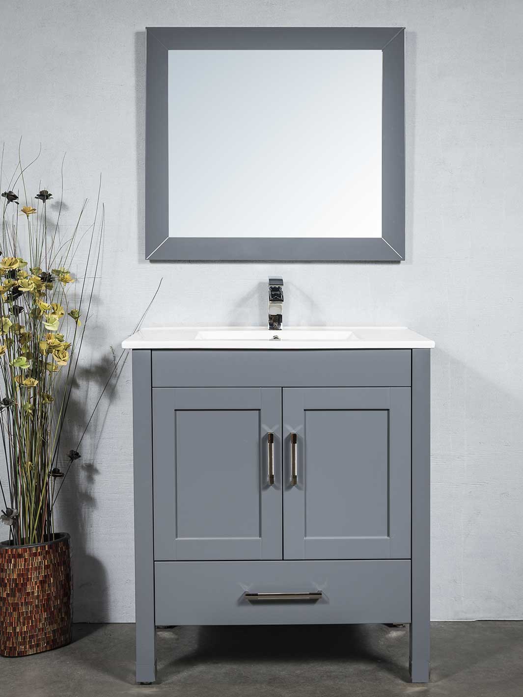 cabinet in grey with matching mirror. white ceramic sink. chrome faucet and pulls