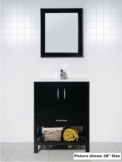 black vanity with open bottom shelf, black framed mirror, white ceramic sink, and chrome faucet