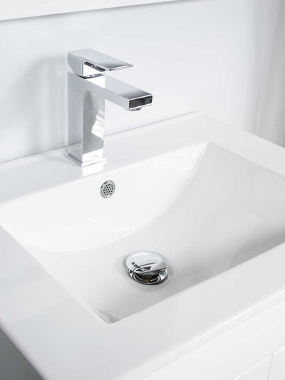 ceramic sink for 28 inch vanity featuring chrome faucet