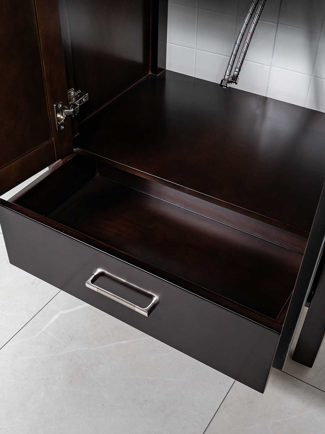drawer at bottom of chocolate brown vanity