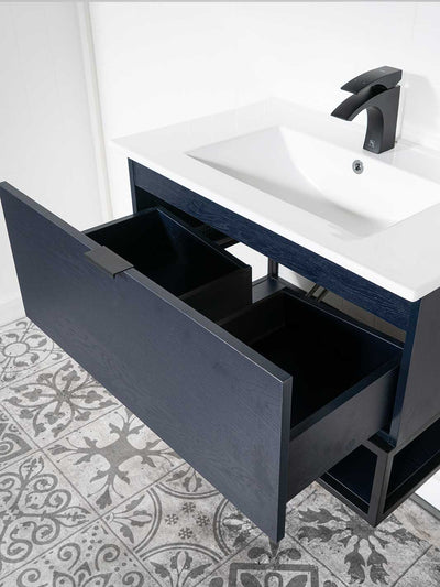 Blue black floating style vanity drawer below sink and bottom shelf