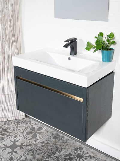 Floating style vanity with dark grey finish, ceramic sink, and black faucet