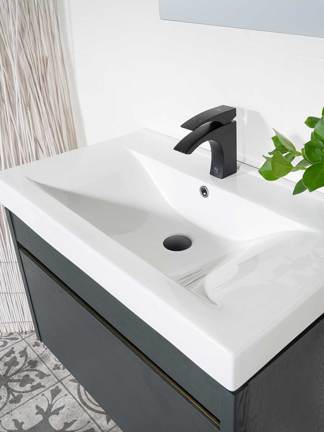 white ceramic sink with black faucet