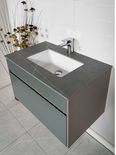 green bathroom vanity floating style with grey sintered stone countertop and chrome faucet