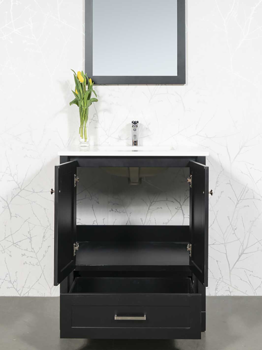 Cupboard and drawer of black vanity with quartz counter and chrome faucet