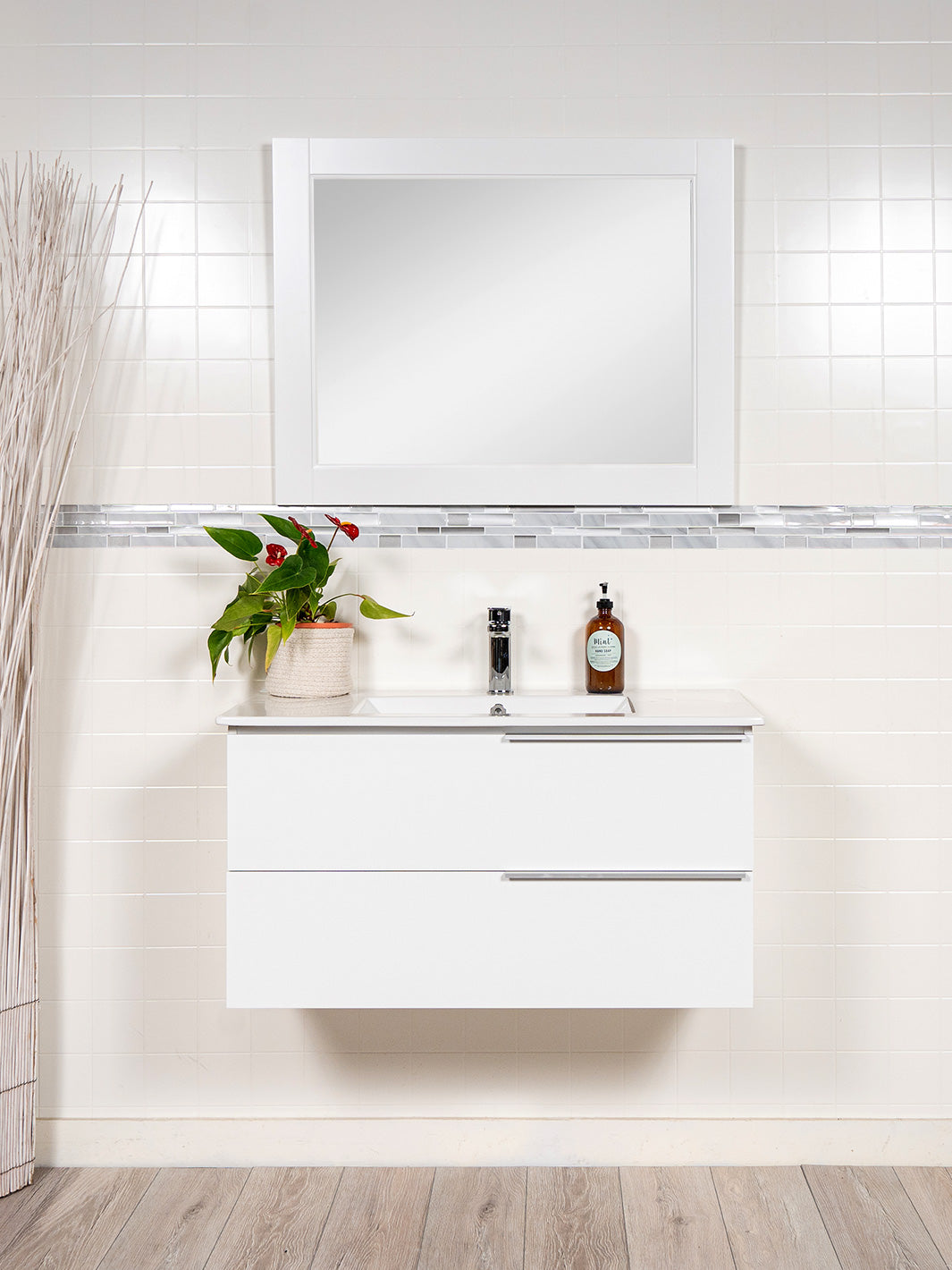 white floating vanity with 2 drawer a white wood framed mirror and chrome faucet