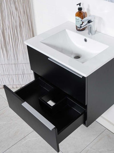 floating vanity black two soft closing drawers. white ceramic sink and chrome faucet