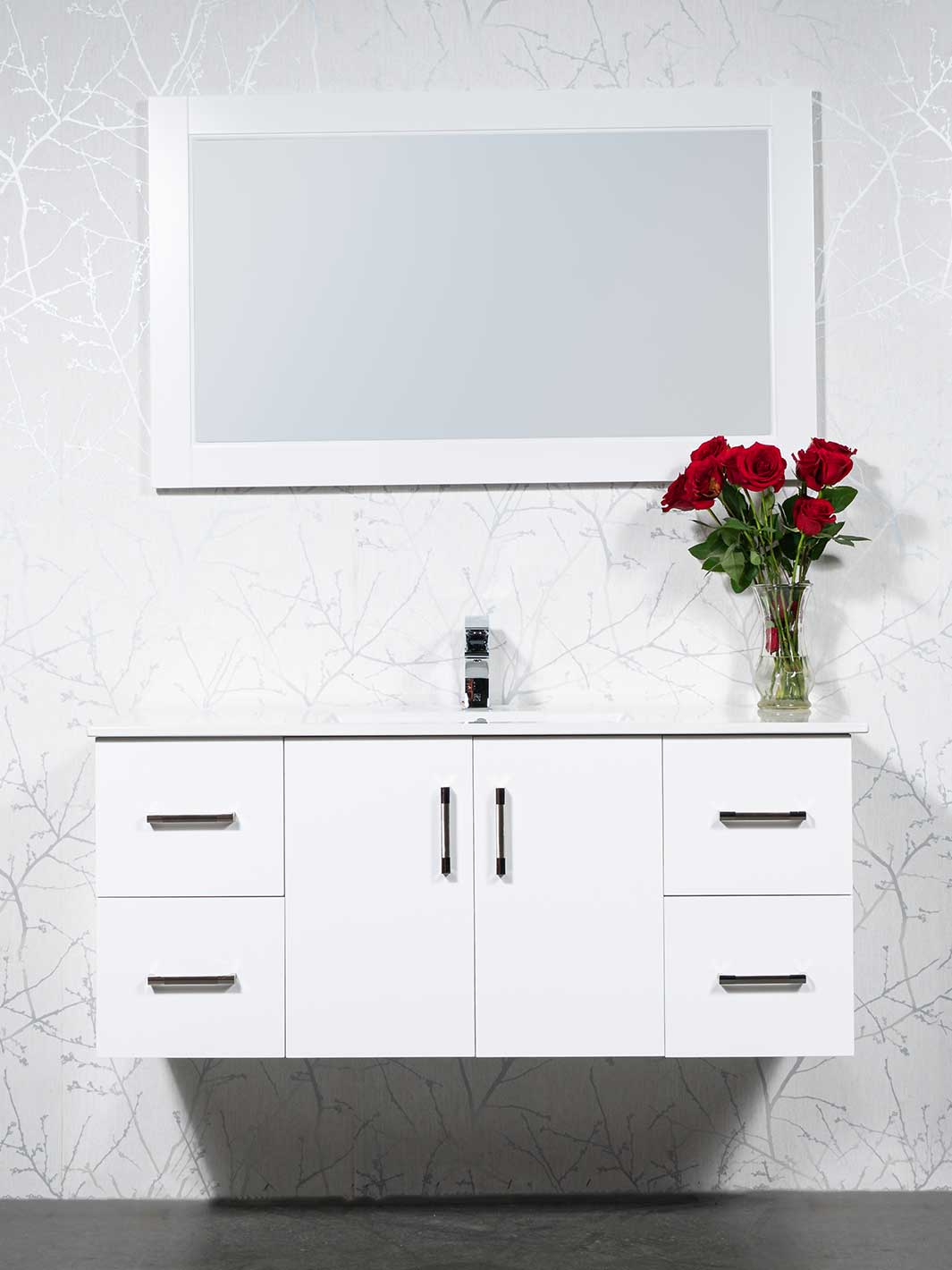 white floating vanity with drawers on each side and a cupboard beneath