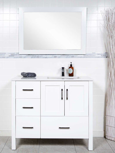 white bathroom cabinet with the sink on the right side. white matching mirror