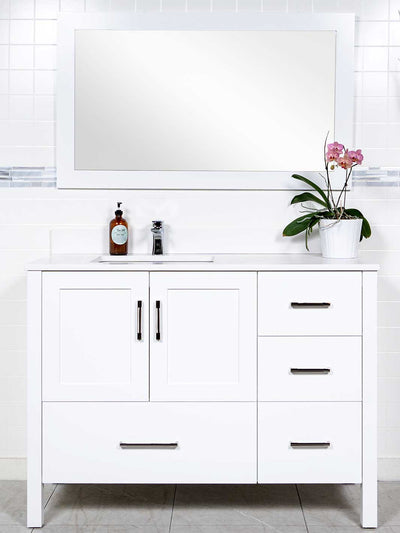 white vanity with offset sink on the left side. matching white mirror