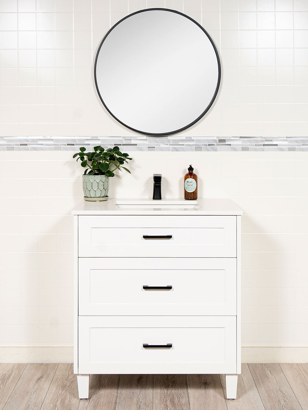 32 inch vanity with drawers. black pulls and round black mirror