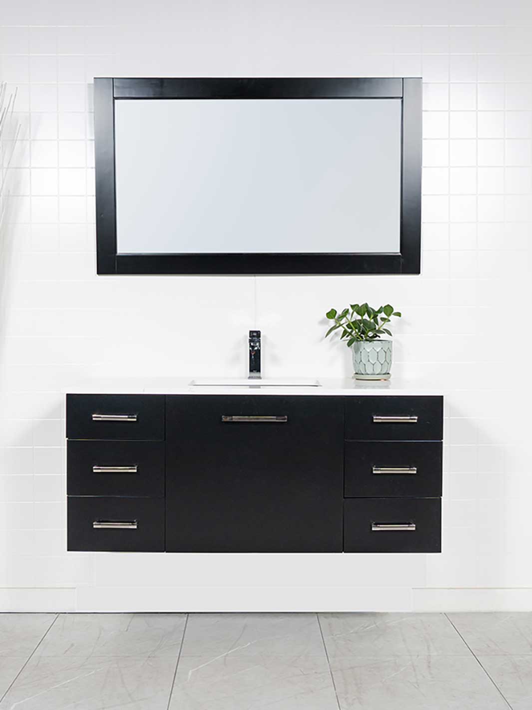 48 inch floating vanity in black with matching black wood framed mirror. white quartz counter and chrome faucet
