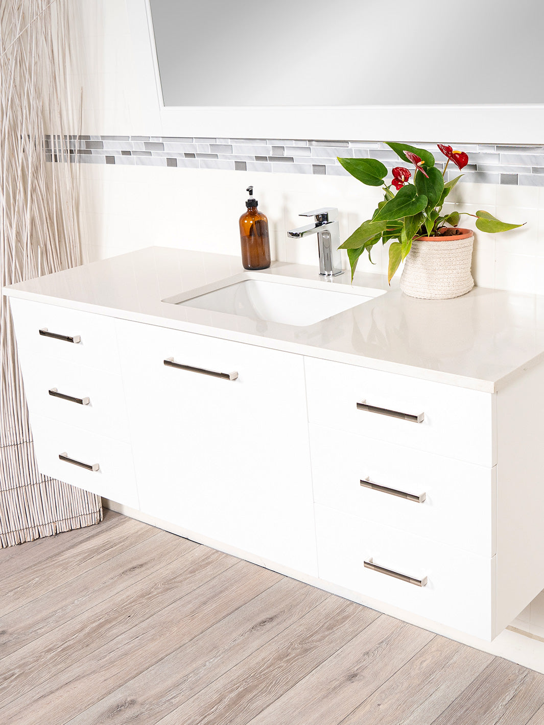 floating vanity counter, chrome faucet. 