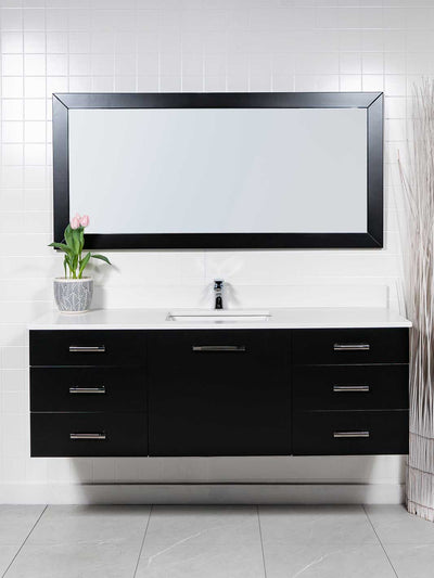 black wall hung vanity 59 inches. 3 drawers either side and deep drawer in center. black wood framed mirror. white counter