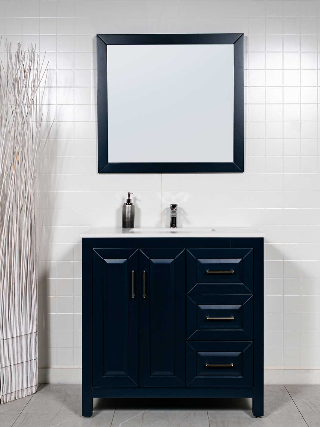 Blue vanity with 3 drawers on the right. White counter. black framed mirror