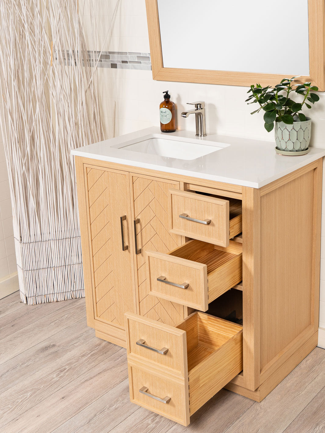 three drawers on right side of cabinet, the bottom one is double deep