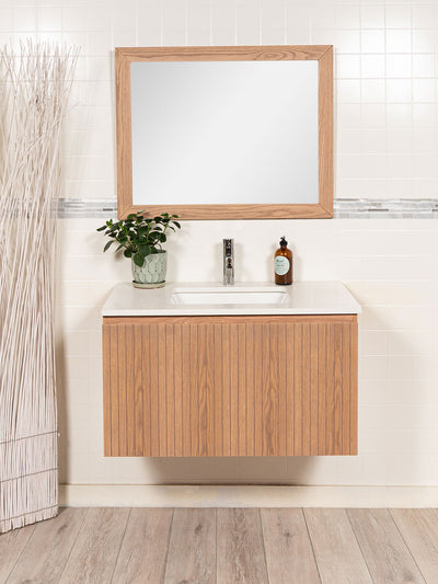 floating vanity with reeded drawers with quartz counter,