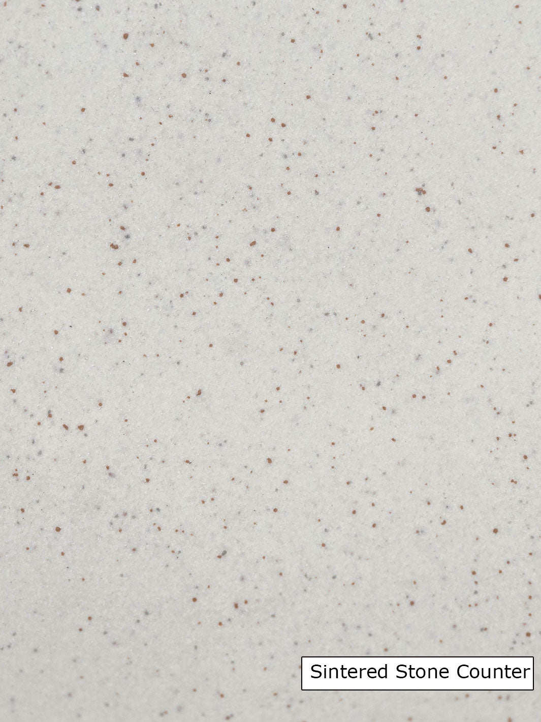 Sintered stone with small reddish and grey flecks on a beige background