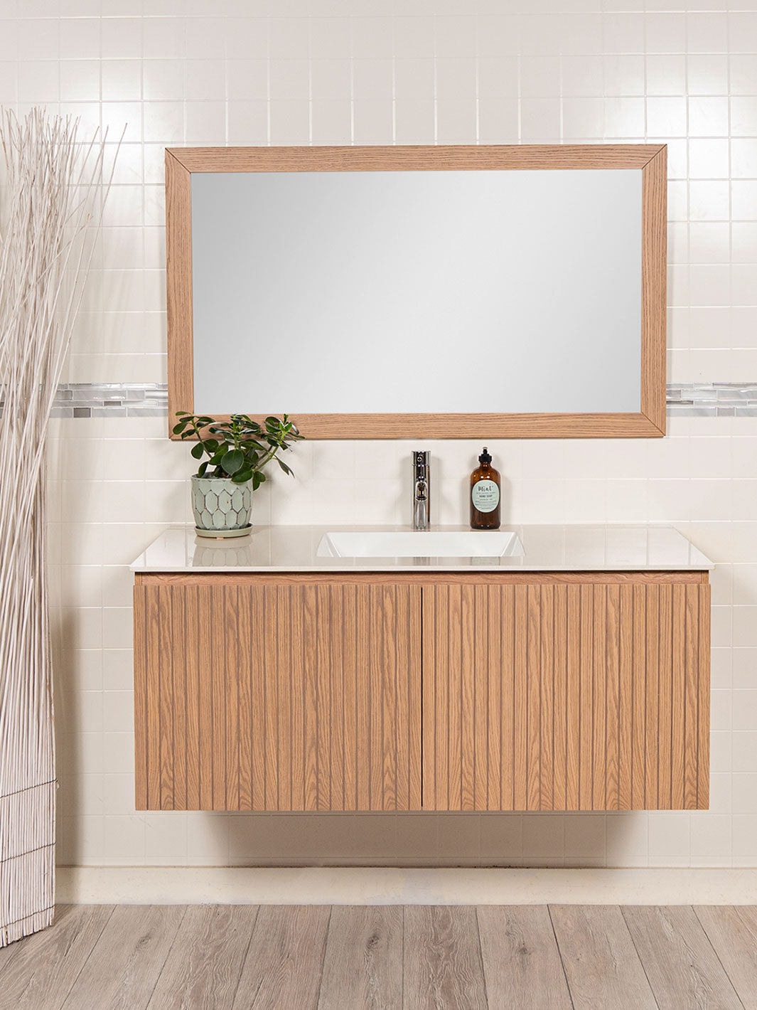 floating vanity with reeded design, wood framed mirrors, sintered stone counter