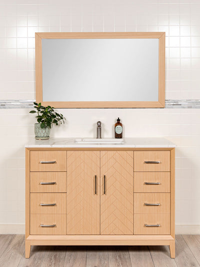 48 inch vanity in light oak with matching mirror. cupboard with herringbone pattern