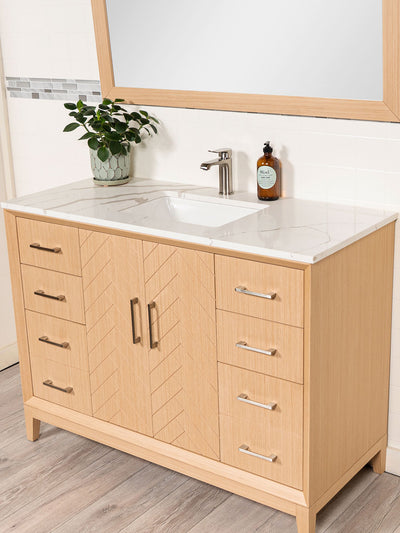 side view of cabinet showing the brushed nickel pulls and herringbone pattern