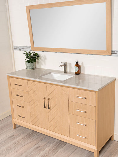 cabinet with quartz counter, wood framed mirror
