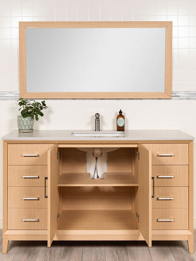 cabinet doors open beneath sink showing shelf and a cut out for the drain