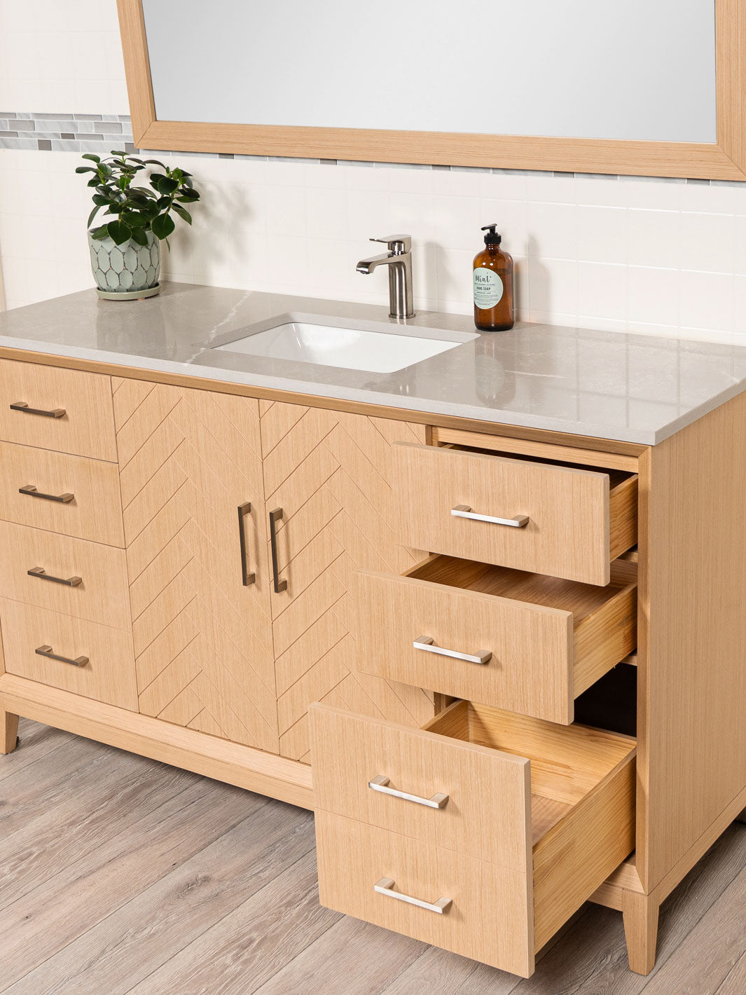 drawers open on the vanity. bottom drawer double deep