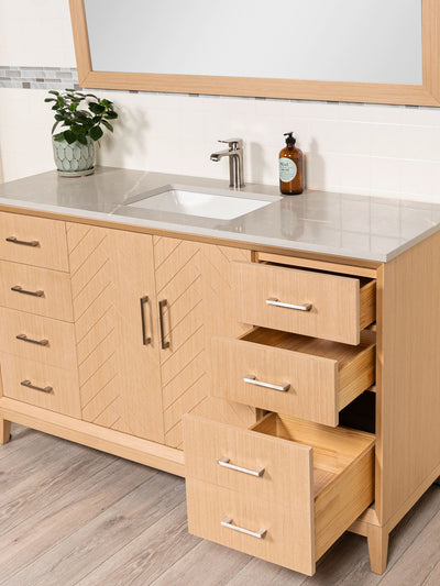 drawers open on the vanity. bottom drawer double deep