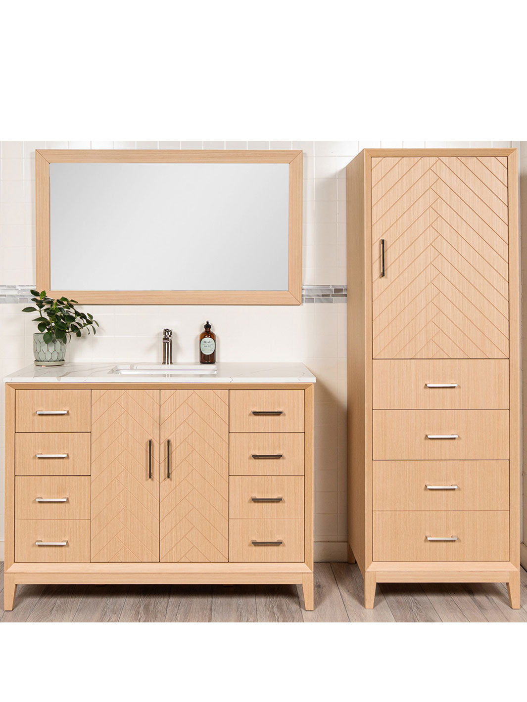 bathroom vanity with linen tower in herringbone pattern