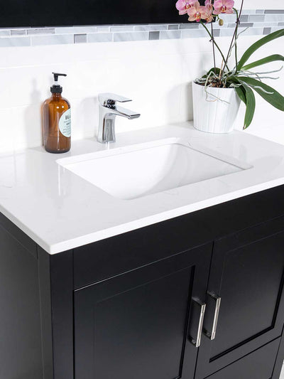 white quartz countertop with chrome faucet