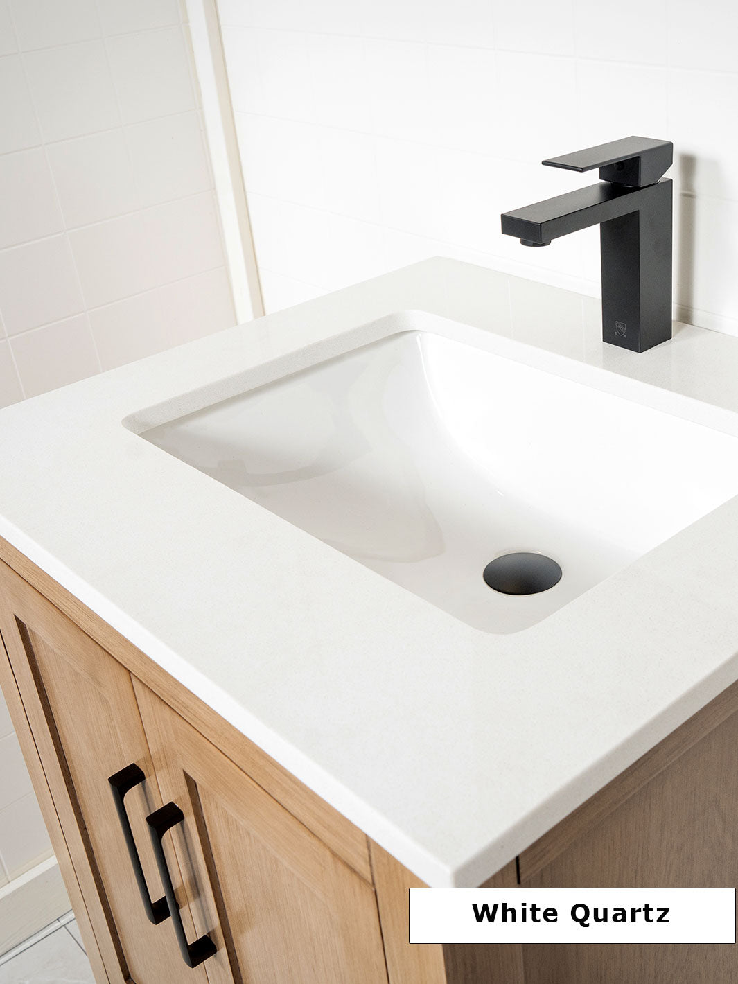 white quartz counter and matte black faucet