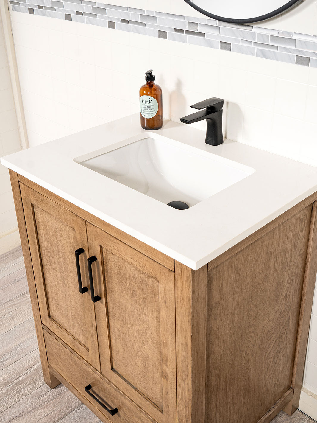 quartz counter and black faucet