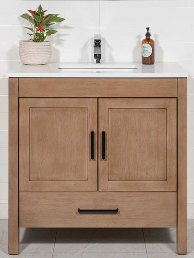 White oak cabinet has shaker style doors and bottom drawer. black door pulls