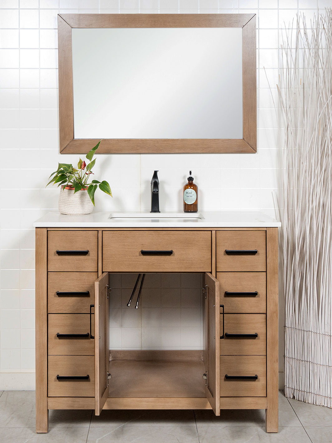 cupboard open on vanity to show space beneath the sink