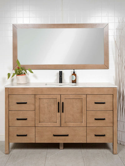 Bathroom vanity with large mirror, drawers, and a countertop.