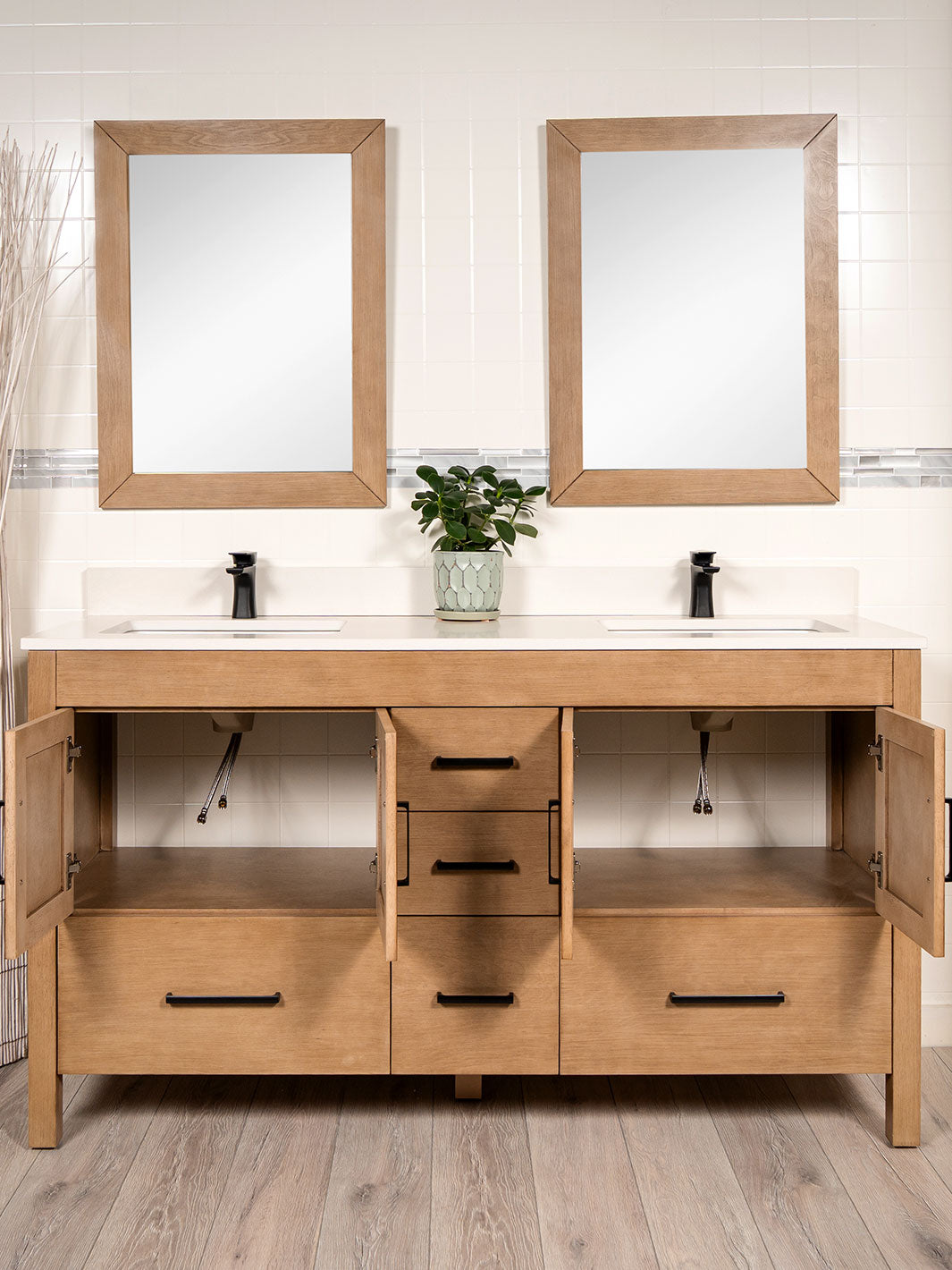 two cupboards open beneath the two sinks