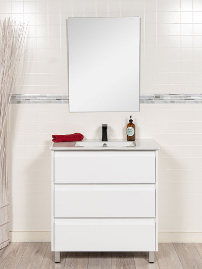 vanity with drawers and unframed mirror. black faucet