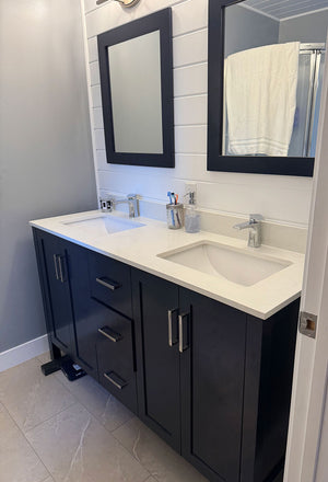 blue double sink vanity with matching mirrors