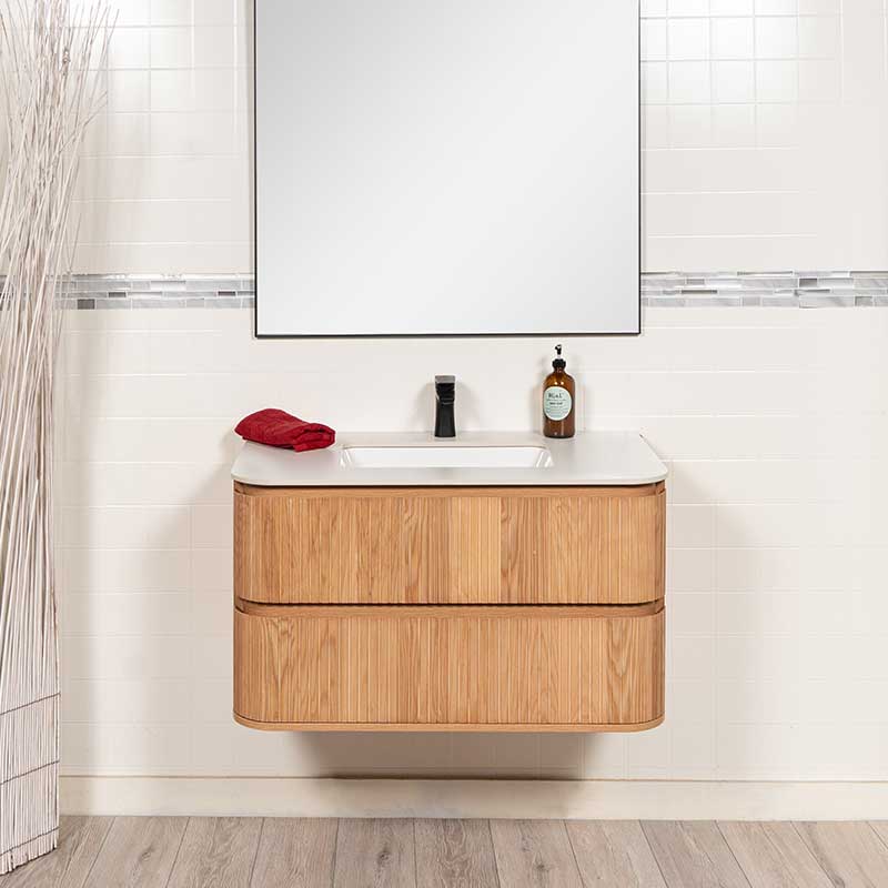 reeded bathroom vanity, black framed mirror and faucet