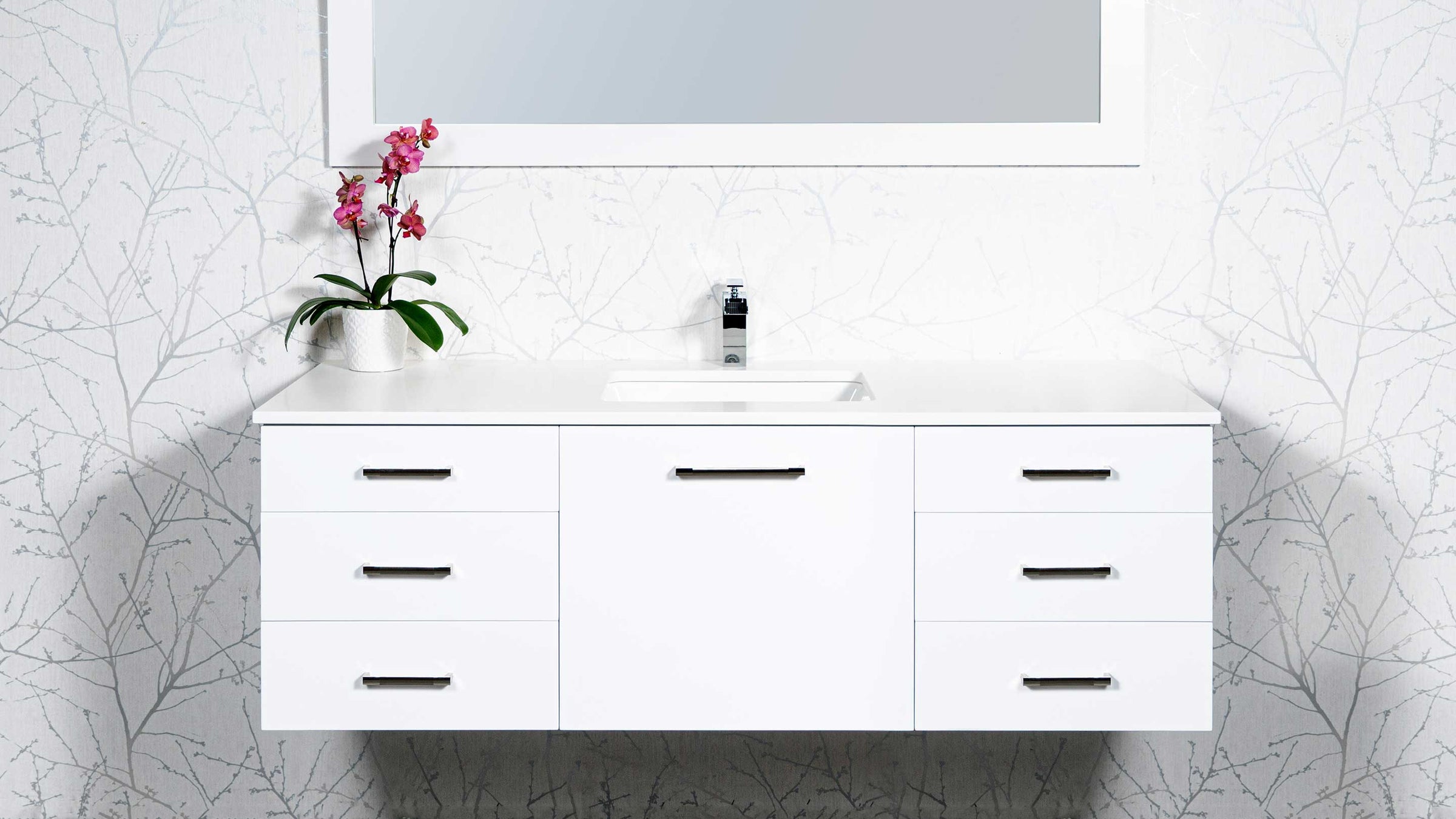 floating vanity in white with drawers, chrome faucet, white wood framed mirror