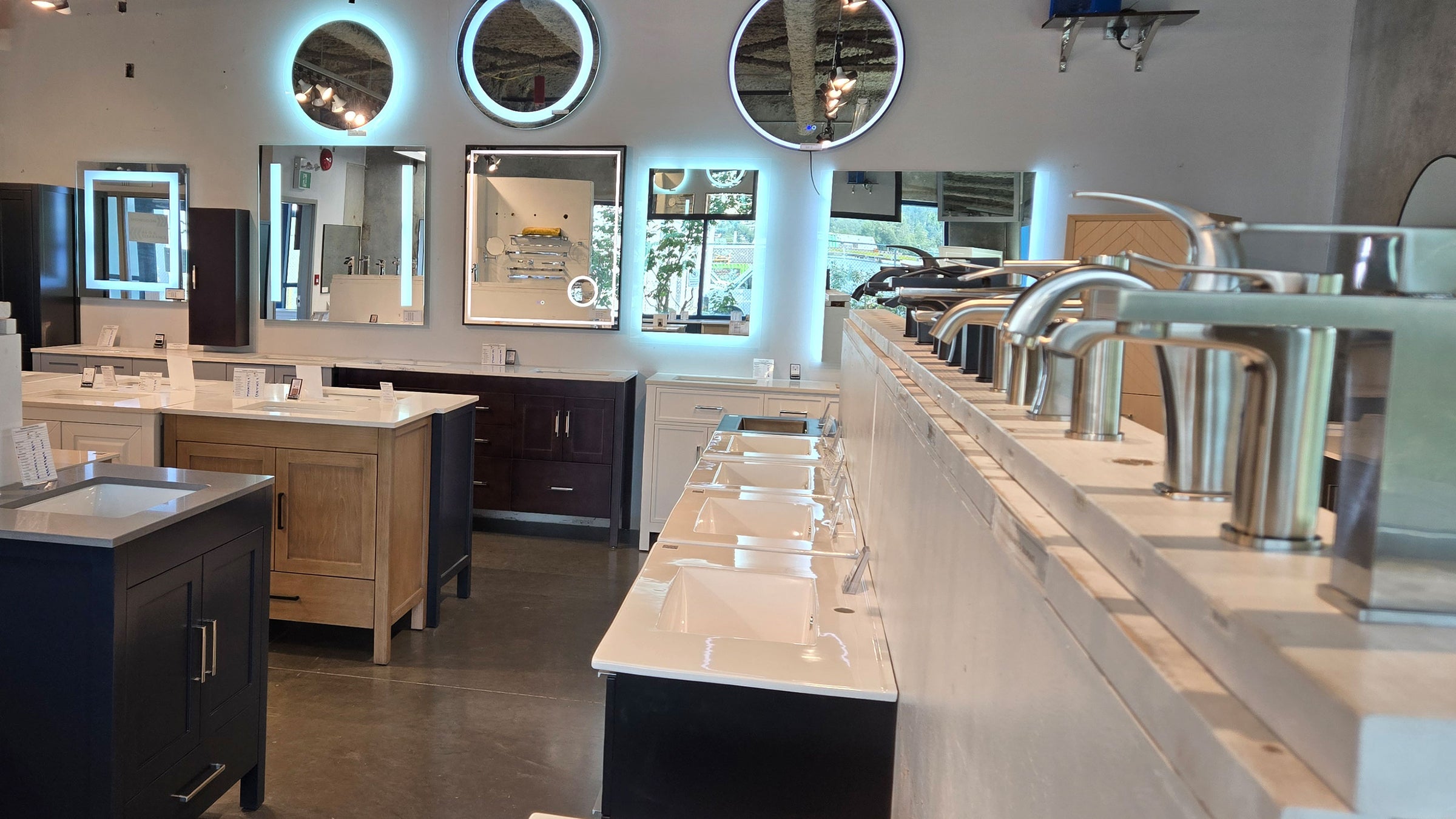 modern bathrooms coquitlam showroom showing backlit mirrors, faucets and vanities