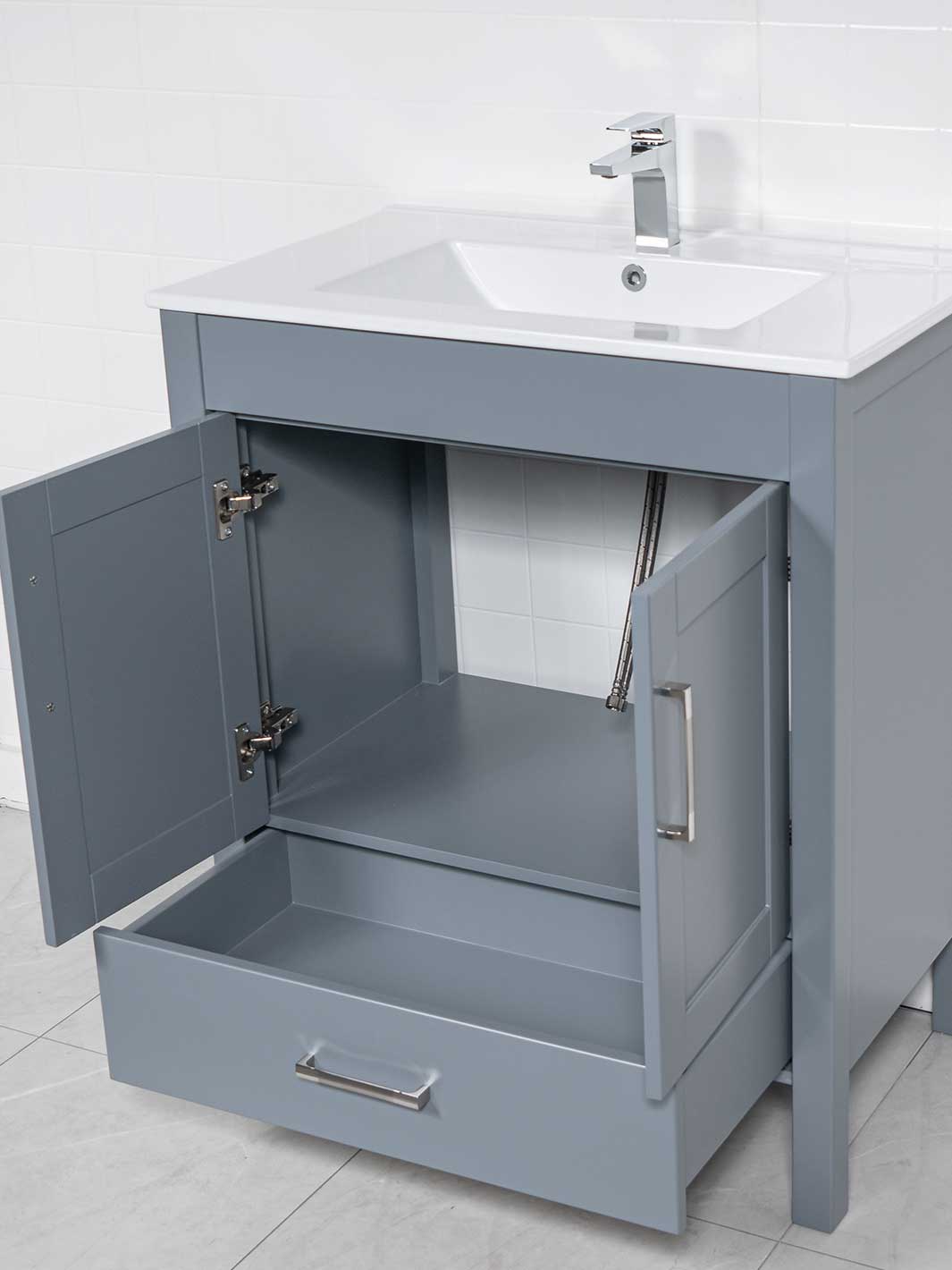 Cupboard under sink with bottom drawer of grey bathroom vanity