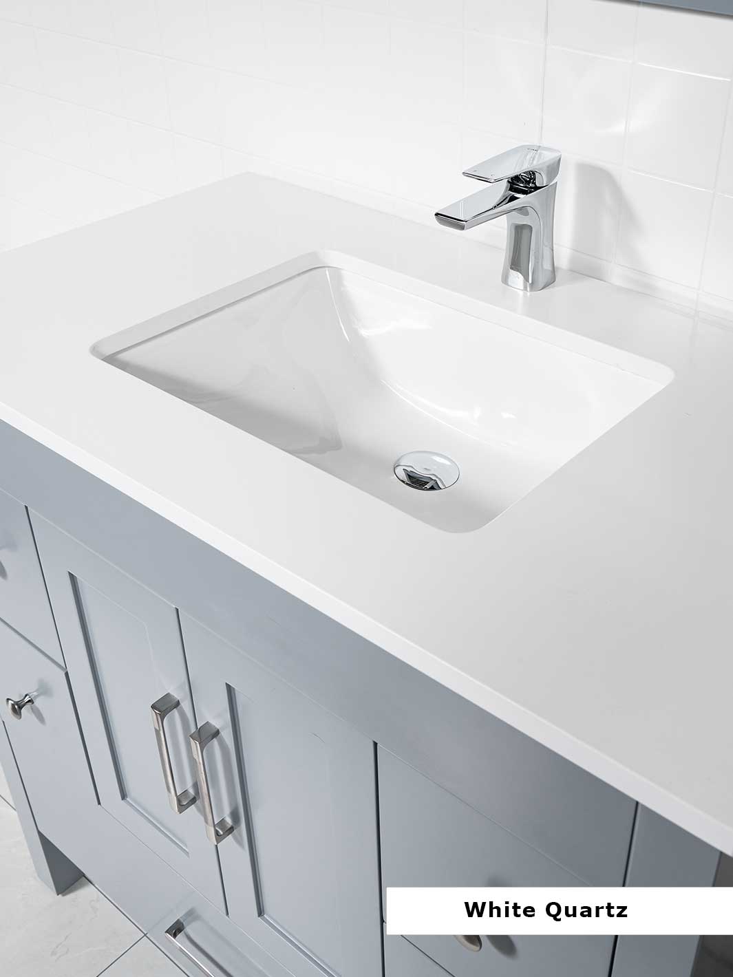 white quartz counter with sink and a chrome faucet