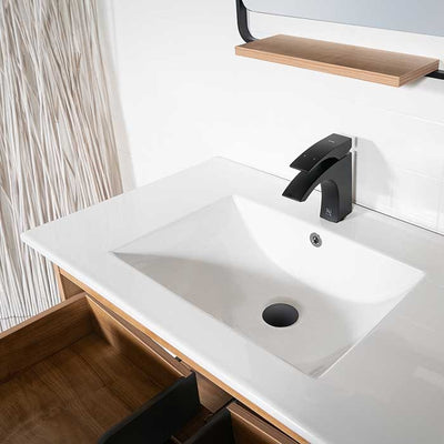 single piece white sink with black faucet